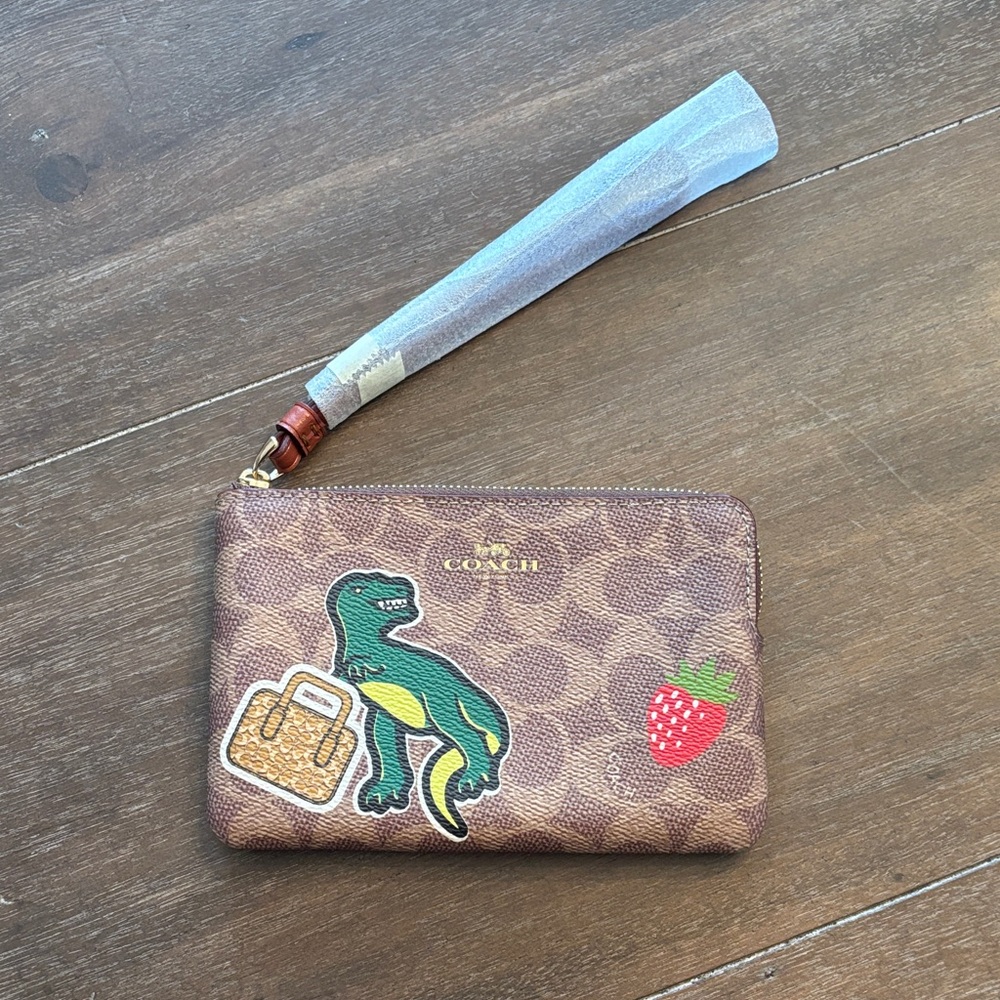 Coach Brown Wristlet with Dinosaur, Strawberry & dice graphics